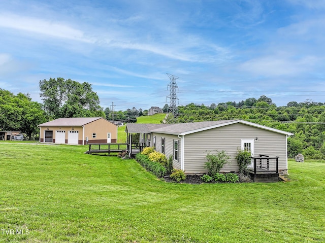 2551 Cedar Creek Rd, Russellville, TN 37860 - back of house with a detached garage, a yard, and an outdoor structure