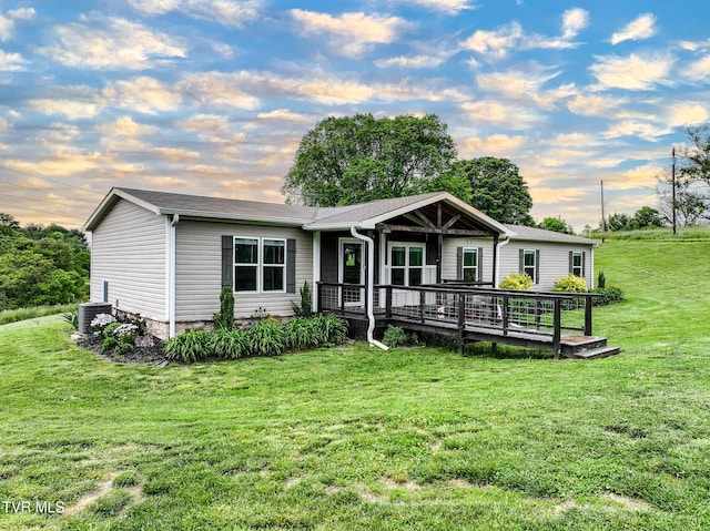 2551 Cedar Creek Rd, Russellville, TN 37860 - view of front facade with a front lawn, cooling unit, and a deck