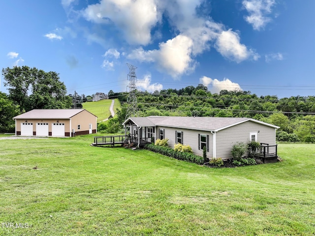2551 Cedar Creek Rd, Russellville, TN 37860 - rear view of property featuring a garage, an outdoor structure, a yard, and a deck