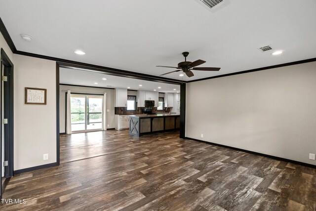 2551 Cedar Creek Rd, Russellville, TN 37860 - unfurnished living room featuring crown molding, dark wood-type flooring, ceiling fan, baseboards, and recessed lighting