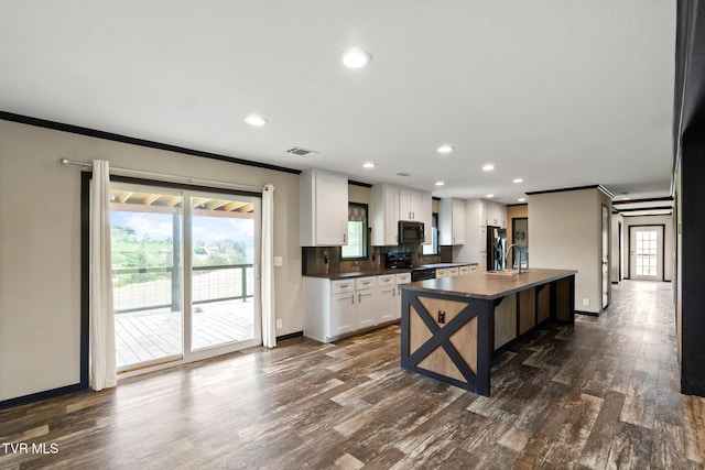 2551 Cedar Creek Rd, Russellville, TN 37860 - kitchen with black appliances, dark countertops, ornamental molding, dark wood-style flooring, and white cabinets