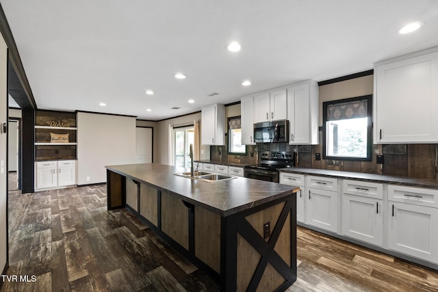 2551 Cedar Creek Rd, Russellville, TN 37860 - kitchen with stainless steel appliances, a sink, dark countertops, decorative backsplash, and crown molding