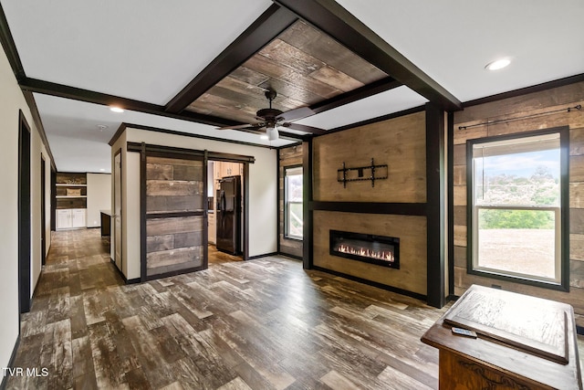 2551 Cedar Creek Rd, Russellville, TN 37860 - unfurnished living room with dark wood finished floors, plenty of natural light, baseboards, a fireplace, and beamed ceiling
