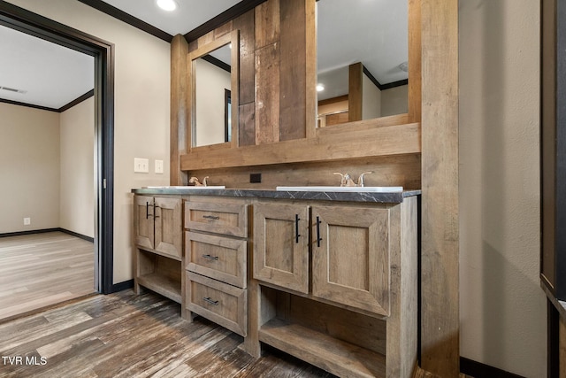 2551 Cedar Creek Rd, Russellville, TN 37860 - bathroom featuring crown molding, wood finished floors, baseboards, double vanity, and recessed lighting