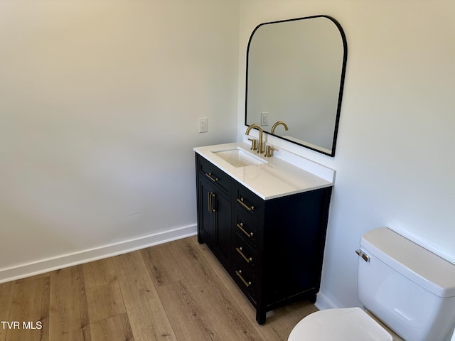 8467 Rich Valley Rd, Bristol, VA 24202 - bathroom with toilet, wood finished floors, vanity, and baseboards