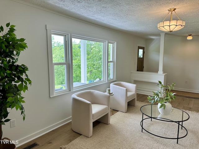 8467 Rich Valley Rd, Bristol, VA 24202 - living area featuring wood finished floors, baseboards, and a textured ceiling