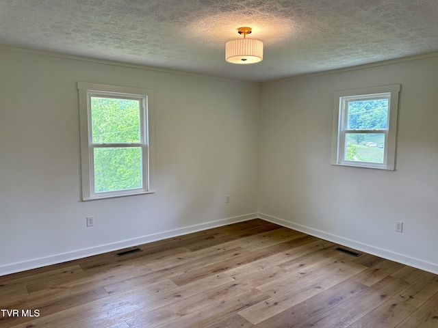 8467 Rich Valley Rd, Bristol, VA 24202 - spare room with a textured ceiling, hardwood / wood-style floors, baseboards, and ornamental molding