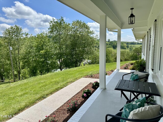 8467 Rich Valley Rd, Bristol, VA 24202 - view of patio / terrace featuring covered porch and view of wooded area