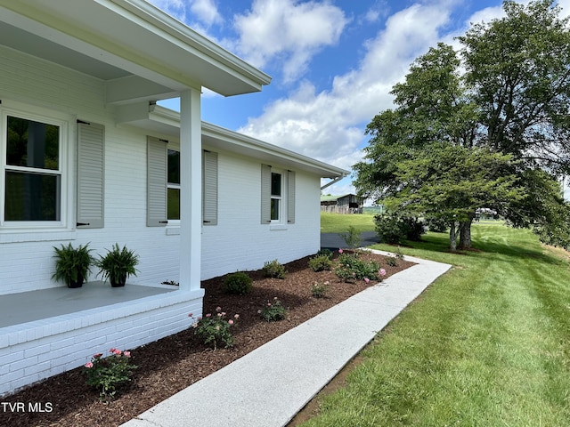 8467 Rich Valley Rd, Bristol, VA 24202 - view of side of home with a yard and brick siding