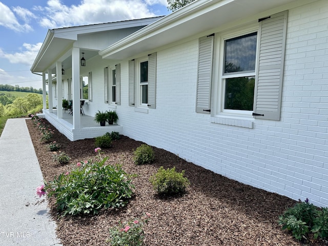 8467 Rich Valley Rd, Bristol, VA 24202 - view of home's exterior featuring covered porch and brick siding