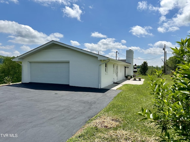 8467 Rich Valley Rd, Bristol, VA 24202 - view of property exterior featuring a chimney, a garage, and a lawn