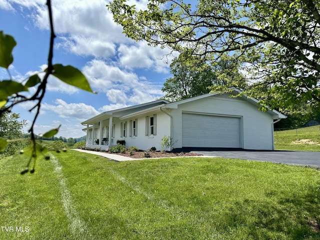 8467 Rich Valley Rd, Bristol, VA 24202 - ranch-style home with driveway, a front yard, an attached garage, and brick siding
