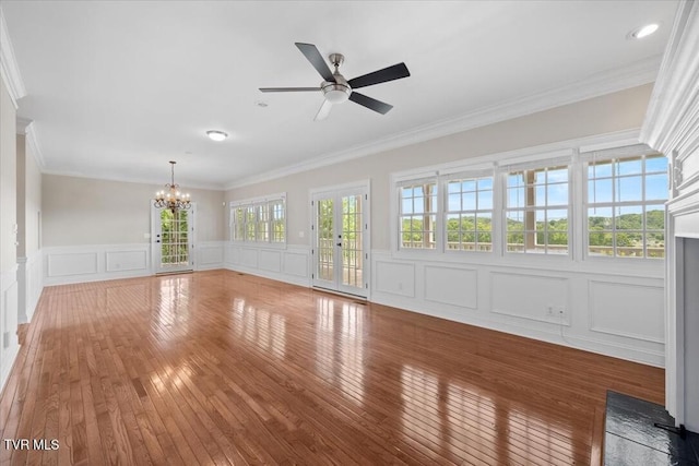 15127 Stonewall Rdg, Bristol, VA 24202 - unfurnished living room with a decorative wall, a chandelier, wood-type flooring, crown molding, and ceiling fan