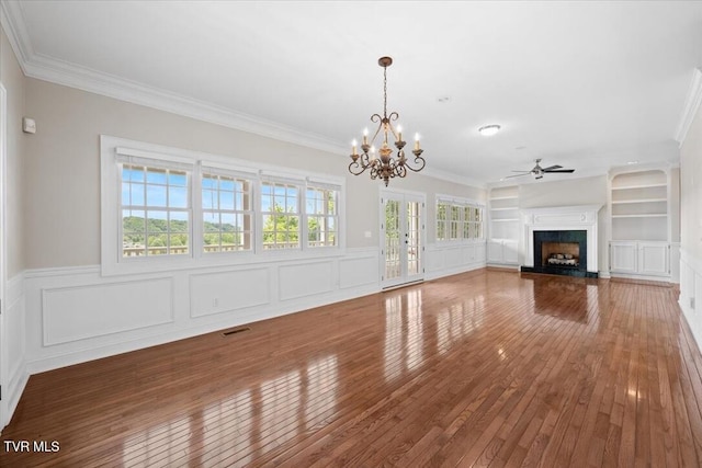 15127 Stonewall Rdg, Bristol, VA 24202 - unfurnished living room with hardwood / wood-style flooring, ornamental molding, a fireplace, ceiling fan, and a chandelier