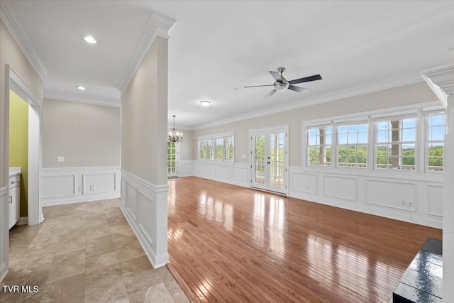 15127 Stonewall Rdg, Bristol, VA 24202 - unfurnished room with a decorative wall, ceiling fan, a chandelier, ornamental molding, and a wainscoted wall