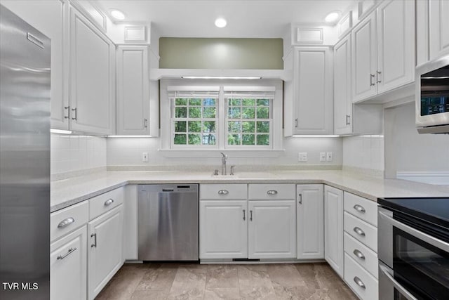 15127 Stonewall Rdg, Bristol, VA 24202 - kitchen featuring stainless steel appliances, white cabinetry, light countertops, decorative backsplash, and recessed lighting