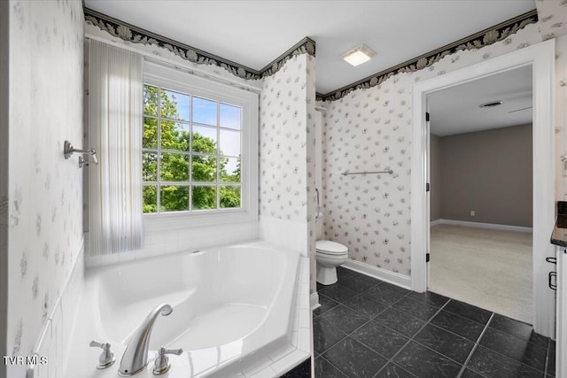 15127 Stonewall Rdg, Bristol, VA 24202 - bathroom with wallpapered walls, toilet, baseboards, a garden tub, and tile patterned floors