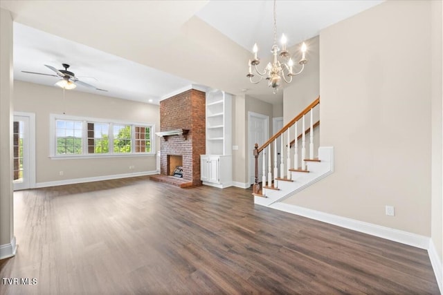 15127 Stonewall Rdg, Bristol, VA 24202 - unfurnished living room with baseboards, dark wood finished floors, a chandelier, and stairs