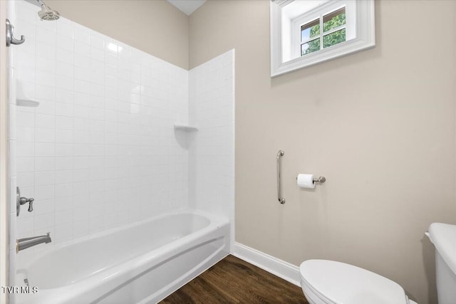 15127 Stonewall Rdg, Bristol, VA 24202 - bathroom with toilet, wood finished floors, baseboards, and shower / washtub combination