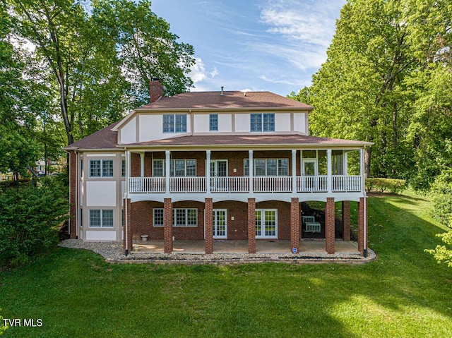 15127 Stonewall Rdg, Bristol, VA 24202 - rear view of property with a patio, a chimney, a yard, and brick siding