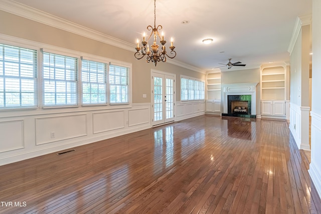 15127 Stonewall Rdg, Bristol, VA 24202 - unfurnished living room featuring a decorative wall, ceiling fan, crown molding, dark wood-style floors, and built in features