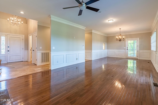 15127 Stonewall Rdg, Bristol, VA 24202 - unfurnished living room with a chandelier, wood-type flooring, a decorative wall, ceiling fan, and ornamental molding