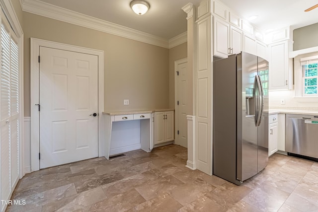 15127 Stonewall Rdg, Bristol, VA 24202 - kitchen with appliances with stainless steel finishes, crown molding, light countertops, light stone finish flooring, and white cabinets
