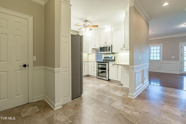 15127 Stonewall Rdg, Bristol, VA 24202 - kitchen featuring stainless steel appliances, ornamental molding, light countertops, a ceiling fan, and white cabinets
