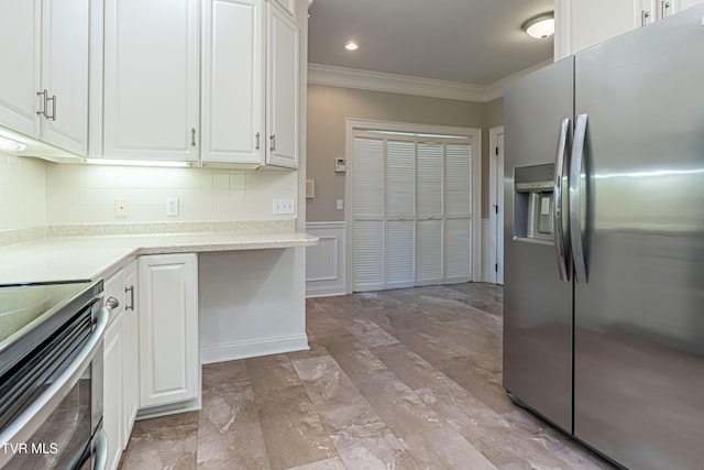 15127 Stonewall Rdg, Bristol, VA 24202 - kitchen with appliances with stainless steel finishes, ornamental molding, white cabinets, light countertops, and tasteful backsplash