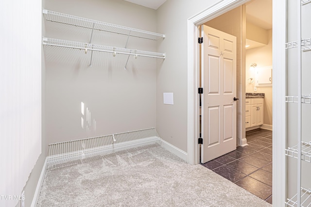 15127 Stonewall Rdg, Bristol, VA 24202 - laundry room with dark tile patterned floors and dark colored carpet