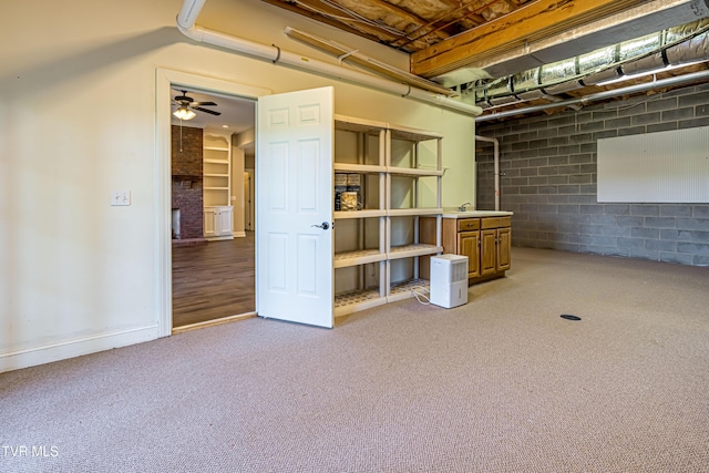 15127 Stonewall Rdg, Bristol, VA 24202 - basement featuring light colored carpet, ceiling fan, concrete block wall, and a brick fireplace