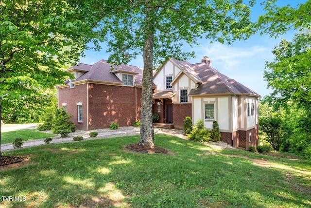 15127 Stonewall Rdg, Bristol, VA 24202 - tudor house featuring brick siding, a chimney, and a front lawn