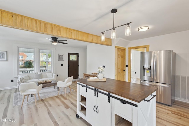 2504 Fort Henry Dr, Kingsport, TN 37664 - kitchen with stainless steel fridge, light wood-type flooring, hanging light fixtures, ceiling fan, and open shelves