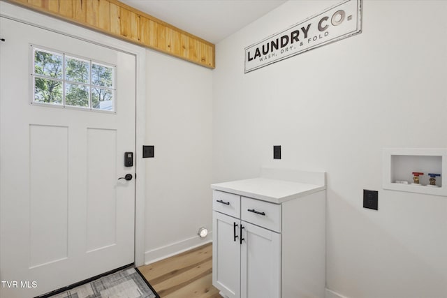 2504 Fort Henry Dr, Kingsport, TN 37664 - laundry area with hookup for a washing machine, cabinet space, baseboards, and light wood-style floors