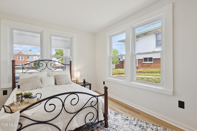 2504 Fort Henry Dr, Kingsport, TN 37664 - bedroom featuring baseboards and wood finished floors
