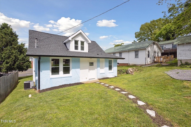 2504 Fort Henry Dr, Kingsport, TN 37664 - view of front of home featuring brick siding, central AC unit, and roof with shingles