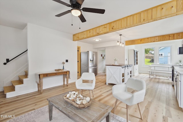 2504 Fort Henry Dr, Kingsport, TN 37664 - living area featuring light wood-type flooring, baseboards, stairway, and ceiling fan