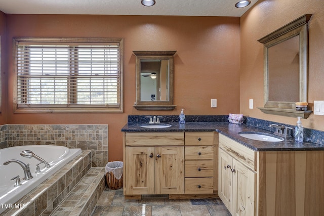 138 Ray Cemetery Rd, Roan Mountain, TN 37687 - full bathroom featuring double vanity, a garden tub, and stone finish floors