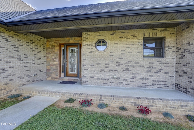 138 Ray Cemetery Rd, Roan Mountain, TN 37687 - doorway to property with a porch and brick siding