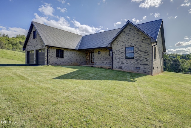138 Ray Cemetery Rd, Roan Mountain, TN 37687 - english style home featuring a garage, brick siding, a front lawn, and crawl space