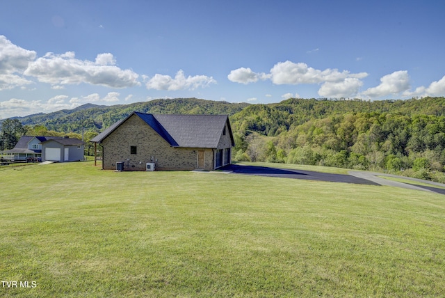138 Ray Cemetery Rd, Roan Mountain, TN 37687 - view of side of property featuring a lawn, a wooded view, and a mountain view