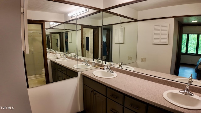 15 Crown Cir Unit 15, Kingsport, TN 37660 - bathroom with double vanity, toilet, and a shower stall