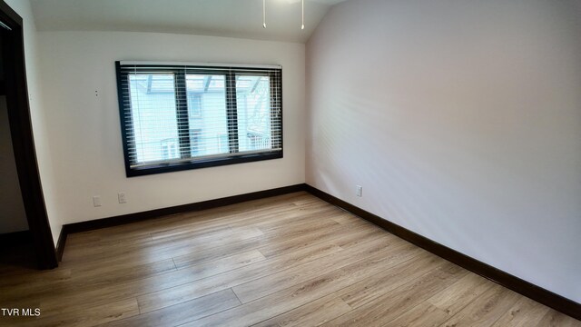 15 Crown Cir Unit 15, Kingsport, TN 37660 - spare room featuring wood finished floors, baseboards, and lofted ceiling