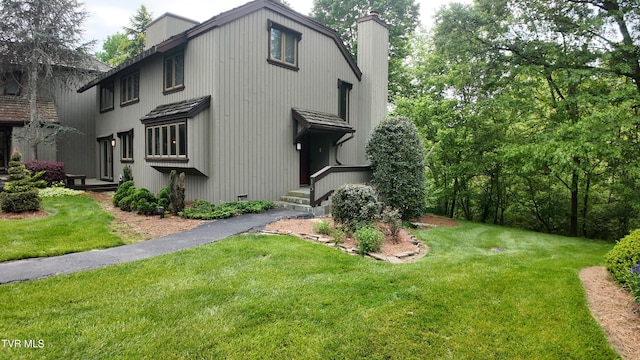 15 Crown Cir Unit 15, Kingsport, TN 37660 - view of side of home featuring a chimney and a lawn