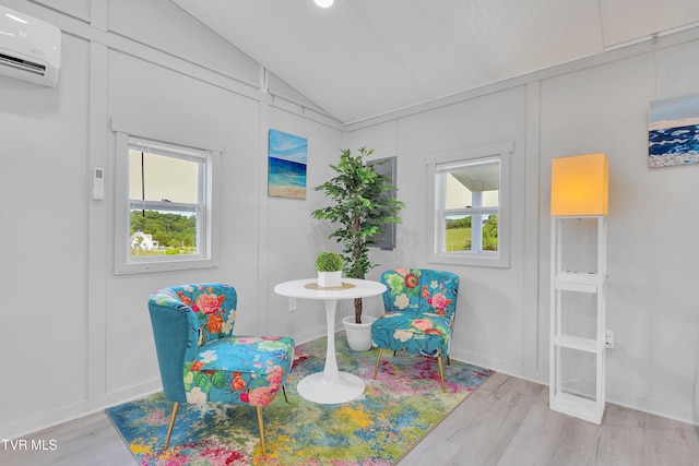1905 Martin Rd, Limestone, TN 37681 - sitting room with lofted ceiling, an AC wall unit, wood finished floors, and baseboards