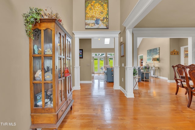 1905 Martin Rd, Limestone, TN 37681 - entryway featuring light wood-style flooring, ornate columns, a high ceiling, and baseboards