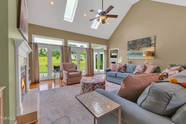 1905 Martin Rd, Limestone, TN 37681 - living area featuring high vaulted ceiling, a lit fireplace, a ceiling fan, french doors, and recessed lighting
