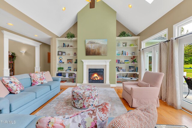 1905 Martin Rd, Limestone, TN 37681 - living area featuring light wood-style flooring, a glass covered fireplace, built in features, recessed lighting, and high vaulted ceiling