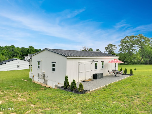1905 Martin Rd, Limestone, TN 37681 - rear view of property featuring a patio, metal roof, a yard, and central AC unit