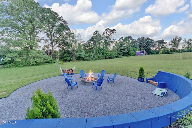 1905 Martin Rd, Limestone, TN 37681 - view of patio / terrace featuring an outdoor fire pit and view of wooded area